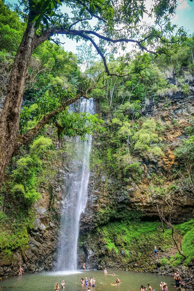 Secret Falls waterfall near Wailua River on Kauai, where Kayak Adventures Kauai tours bring visitors to swim in a tropical paradise.