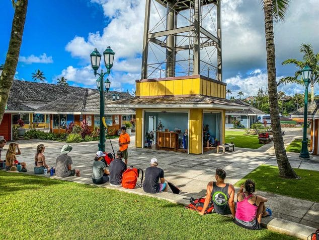 Kayak Adventures Kauai group receiving pre-tour instructions at the Coconut Marketplace check-in site.